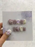 ناخن مصنوعی برجسته صورتی شیری راسا طرح کهکشان و صلیب نگین دار