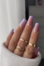 ناخن مصنوعی راسا طرح فرنچ و آمبره شاین رنگ یاسی طلایی