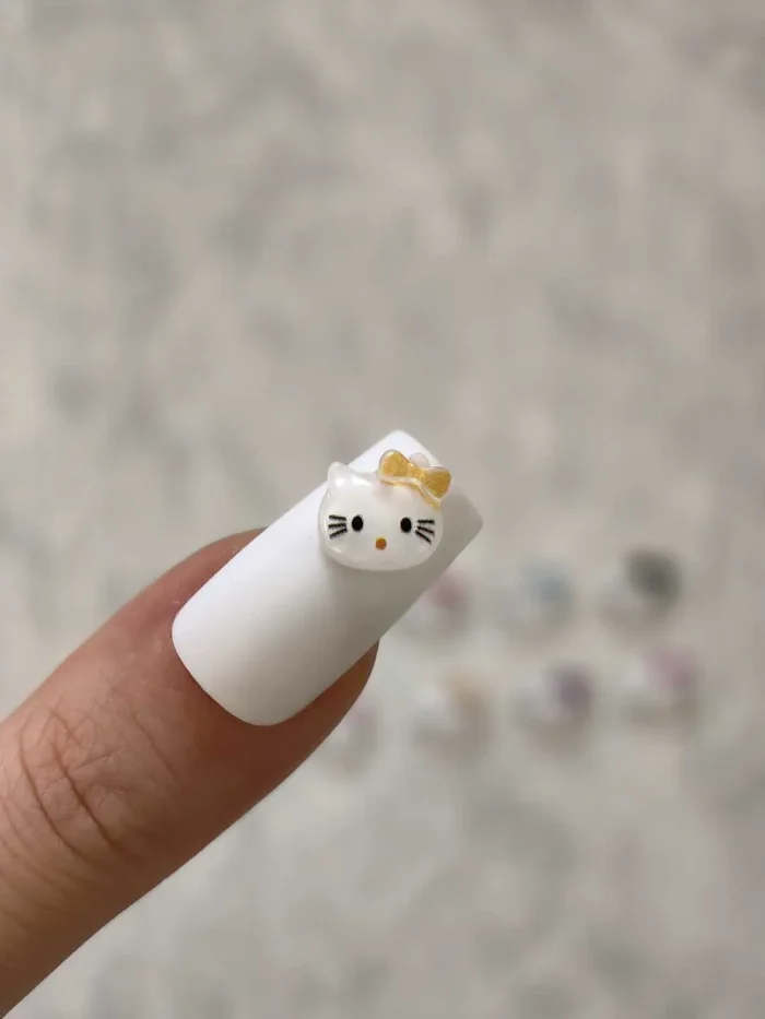 استیکر برجسته ناخن راسا طرح صورت کیتی رنگ سفید نارنجی