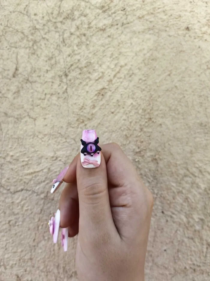 ناخن مصنوعی راسا رنگ سفید و صورتی طرح چشم و عنکبوت دارک RSR1125