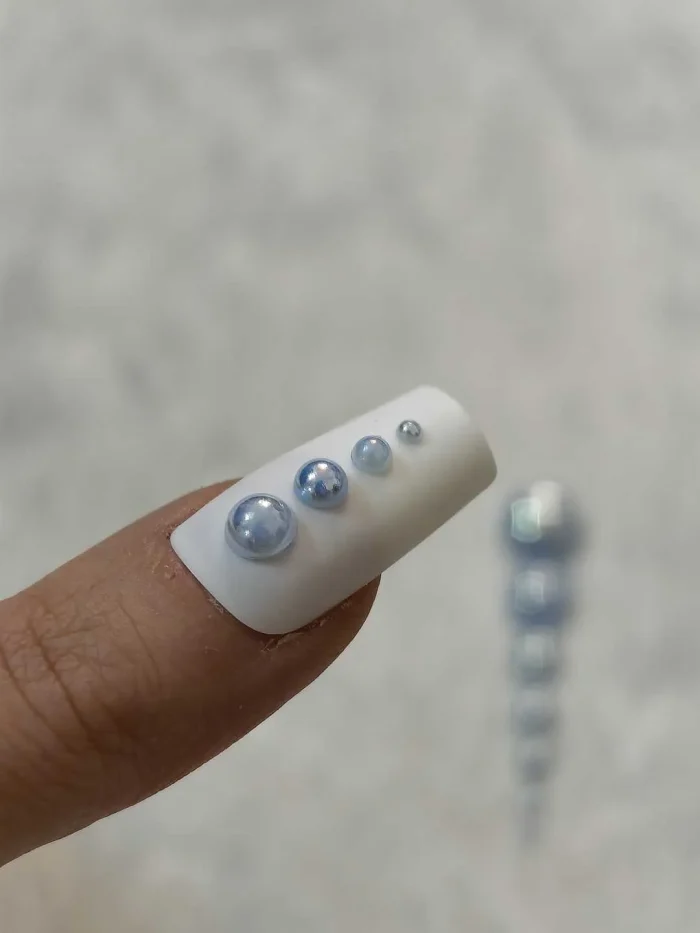 استیکر برجسته ناخن راسا طرح نگین آبی بسته 7 عددی