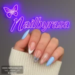 ناخن مصنوعی زمستانی طرح پاپیون و برف فرنچ آبی روشن