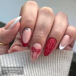 ناخن مصنوعی زمستانی قرمز رنگ طرح پاپیون