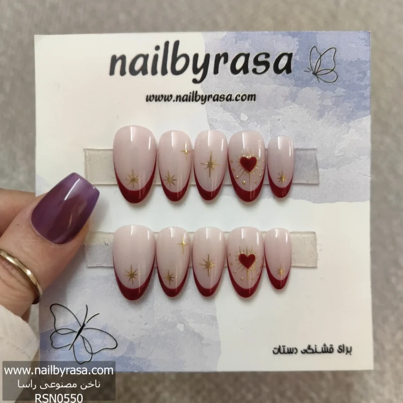 ناخن مصنوعی ژورنالی عاشقانه شیری و زرشکی با طرح قلب طلایی و ستاره، فرم بیضی و فرنچ برای استایل خاص Nail by Rasa RSN0550
